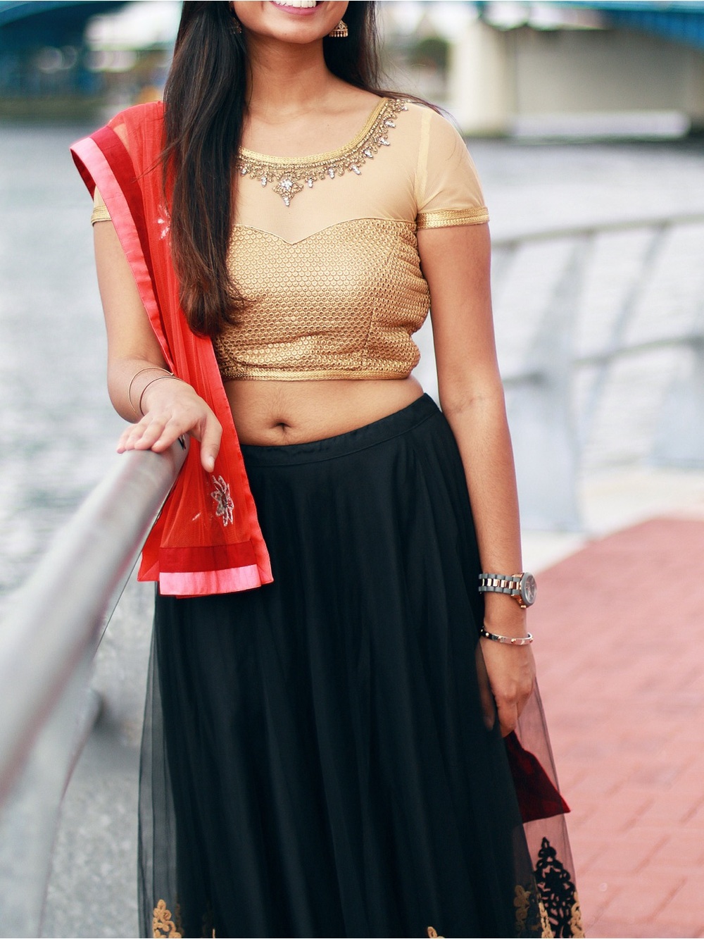 Black and gold lehenga with multicolor dupatta
